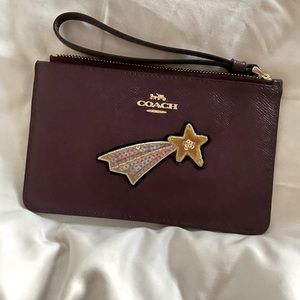 Coach. Shooting star wristlet